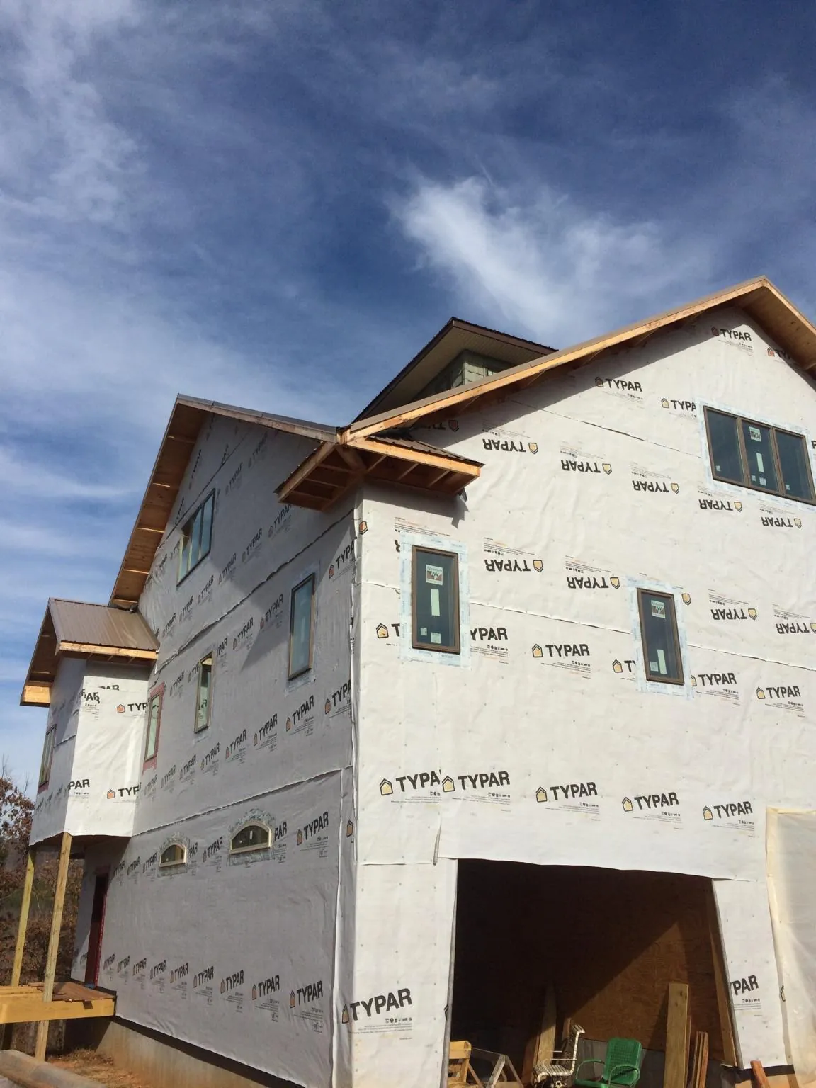 Stick built house wrapped in Typar with new roof framing and dormers in Pawnee